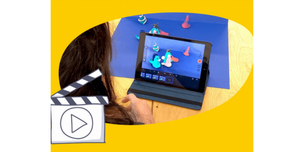 Foto von einem Kind, das vor einem Tablet sitzt, auf dem ein Stop-Motion-Trickfilm gefilmt wird.